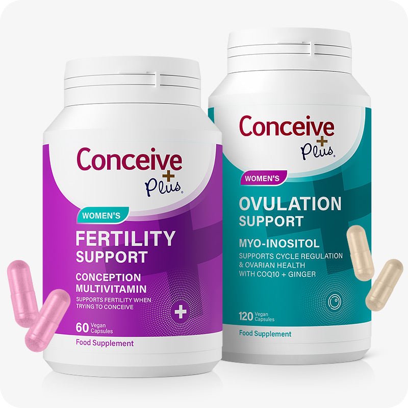 Conceive Plus Ovulation Pack - Fertility + Ovulation Supplements featuring two bottles—purple-labeled Women’s Fertility Support with 60 vegan capsules and teal-labeled Ovulation Support with 120 vegan capsules—shown with pink and beige capsules on a clean white background.