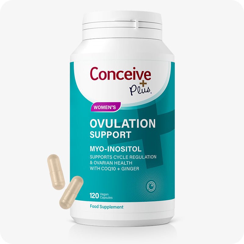 Conceive Plus Ovulation Support supplement bottle for women, featuring 120 vegan capsules. The teal and white label emphasizes Myo-Inositol, CoQ10, and Ginger for cycle regulation and ovarian health. Two light yellow capsules are displayed beside the bottle.