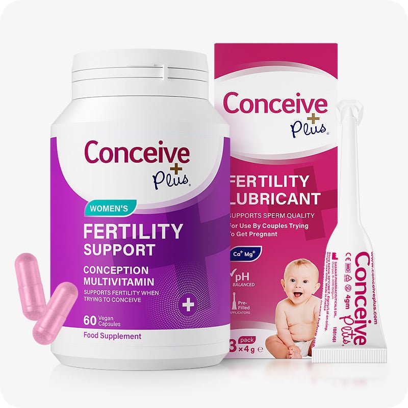 Conceive Plus Women's Fertility Support + Applicators featuring a purple-labeled 60-capsule fertility supplement bottle and a 3-pack of pre-filled vaginal lubricant applicators with outer box, displayed on a white background with pink capsules in the foreground.