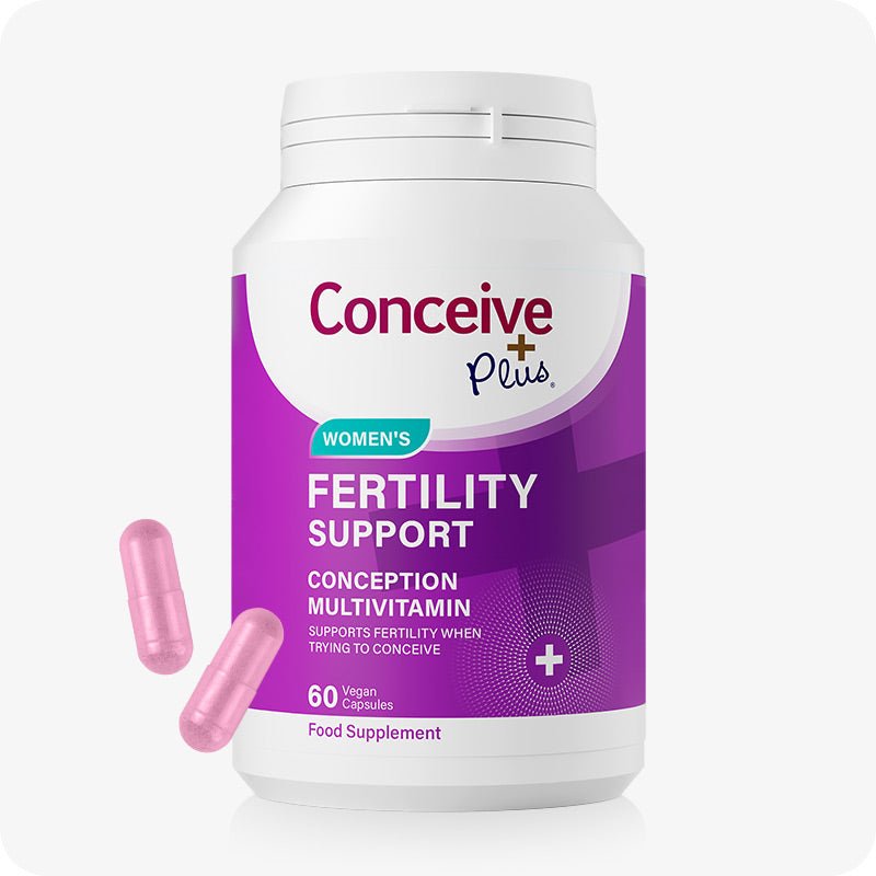 Conceive Plus Women's Fertility Support + Applicators featuring a front-facing view of purple-labeled 60-capsule women's fertility support supplement bottle with two pink capsules in the foreground, displayed on a white background.