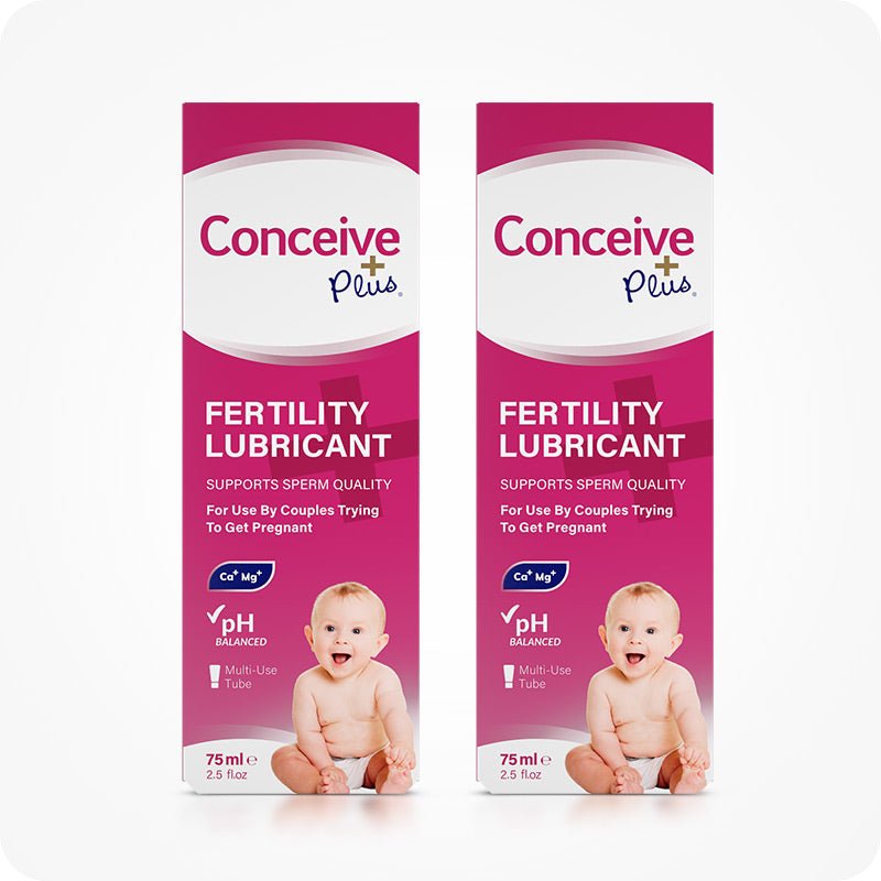 Image of two boxes of Conceive Plus fertility lubricant tube 75ml placed side by side on a white background. Pink boxes with white branding and text have highlights about sperm quality support, pH balance, Calcium and Magnesium ions, multi-use feature, and quantity of the lube. Boxes also feature a smiling baby.