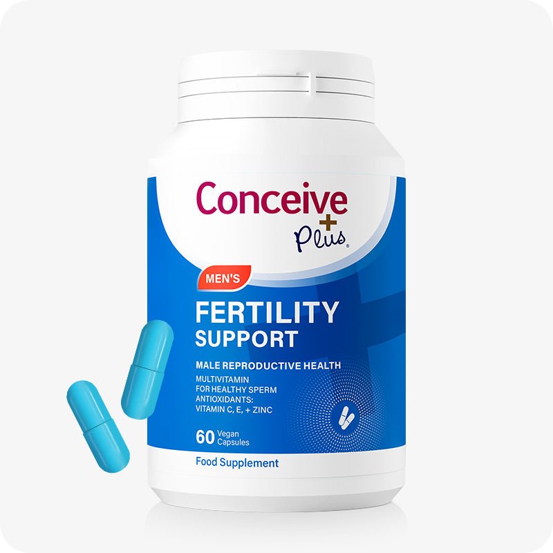 Conceive Plus Men's Fertility Support supplement bottle with 60 blue vegan capsules. Blue and white label highlights support for male reproductive health, including sperm quality and antioxidant protection with vitamins C, E, and zinc. Two capsules are placed beside the bottle for visual reference.